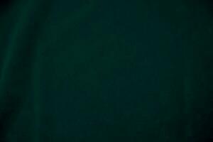 Green velvet fabric texture used as background. Empty green fabric background of soft and smooth textile material. There is space for text. photo