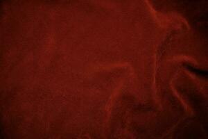 Red velvet fabric texture used as background. red fabric background of soft and smooth textile material. There is space for text.. photo