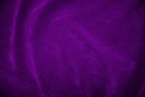 Purple velvet fabric texture used as background. Violet fabric background of soft and smooth textile material. There is space for text. photo