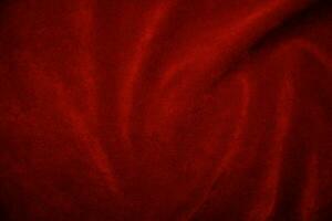 Red velvet fabric texture used as background. red fabric background of soft and smooth textile material. There is space for text.. photo