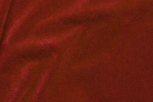 Red velvet fabric texture used as background. red fabric background of soft and smooth textile material. There is space for text. photo