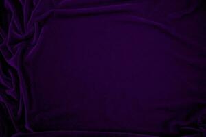 Purple velvet fabric texture used as background. Violet color panne fabric background of soft and smooth textile material. crushed velvet .luxury magenta tone for silk. photo
