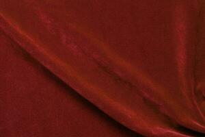 Red velvet fabric texture used as background. red fabric background of soft and smooth textile material. There is space for text. photo