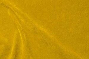 Yellow velvet fabric texture used as background. violet fabric background of soft and smooth textile material. There is space for text. photo