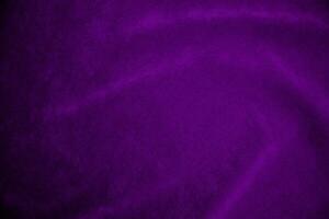 Purple velvet fabric texture used as background. Violet fabric background of soft and smooth textile material. There is space for text. photo