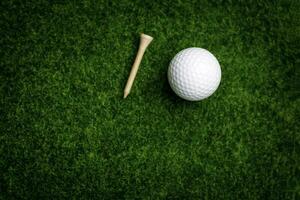 Golf ball close up on tee grass on blurred beautiful landscape of golf background. Concept international sport that rely on precision skills for health relaxation. photo