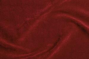 Red velvet fabric texture used as background. red fabric background of soft and smooth textile material. There is space for text. photo