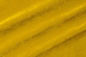 Yellow velvet fabric texture used as background. violet fabric background of soft and smooth textile material. There is space for text. photo