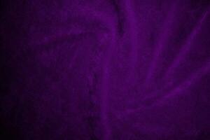 Purple velvet fabric texture used as background. Violet fabric background of soft and smooth textile material. There is space for text. photo