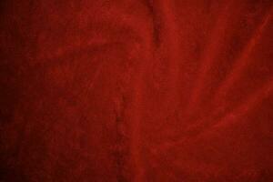 rojo terciopelo tela textura usado como antecedentes. rojo tela antecedentes de suave y suave textil material. allí es espacio para texto.. foto