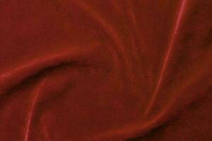 Red velvet fabric texture used as background. red fabric background of soft and smooth textile material. There is space for text. photo