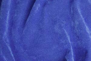 blue velvet fabric texture used as background. blue fabric background of soft and smooth textile material. There is space for text. photo