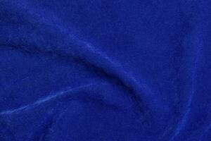 blue velvet fabric texture used as background. blue fabric background of soft and smooth textile material. There is space for text. photo