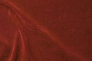 Red velvet fabric texture used as background. red fabric background of soft and smooth textile material. There is space for text. photo