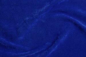 blue velvet fabric texture used as background. blue fabric background of soft and smooth textile material. There is space for text. photo