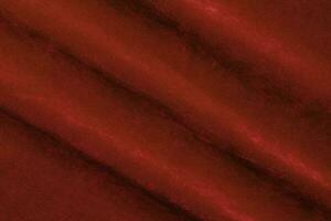 Red velvet fabric texture used as background. red fabric background of soft and smooth textile material. There is space for text. photo