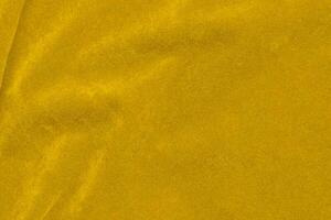 Yellow velvet fabric texture used as background. violet fabric background of soft and smooth textile material. There is space for text. photo