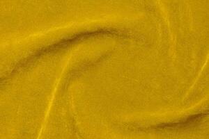 Yellow velvet fabric texture used as background. violet fabric background of soft and smooth textile material. There is space for text. photo