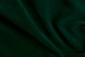 verde terciopelo tela textura usado como antecedentes. verde tela antecedentes de suave y suave textil material. allí es espacio para texto. foto