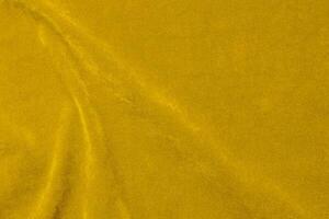 Yellow velvet fabric texture used as background. violet fabric background of soft and smooth textile material. There is space for text. photo