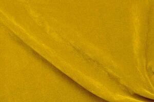 Yellow velvet fabric texture used as background. violet fabric background of soft and smooth textile material. There is space for text. photo