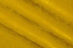 Yellow velvet fabric texture used as background. violet fabric background of soft and smooth textile material. There is space for text. photo