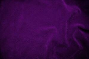 Purple velvet fabric texture used as background. Violet fabric background of soft and smooth textile material. There is space for text. photo