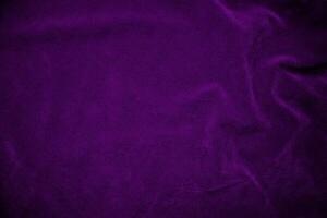 Purple velvet fabric texture used as background. Violet fabric background of soft and smooth textile material. There is space for text. photo