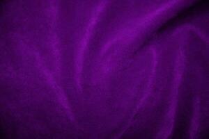 Purple velvet fabric texture used as background. Violet fabric background of soft and smooth textile material. There is space for text. photo