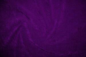 Purple velvet fabric texture used as background. Violet fabric background of soft and smooth textile material. There is space for text. photo
