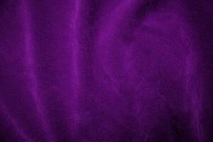 Purple velvet fabric texture used as background. Violet fabric background of soft and smooth textile material. There is space for text. photo