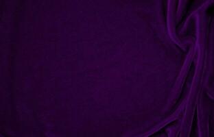 Purple velvet fabric texture used as background. Violet color panne fabric background of soft and smooth textile material. crushed velvet .luxury magenta tone for silk. photo