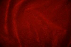 Red velvet fabric texture used as background. red fabric background of soft and smooth textile material. There is space for text.. photo