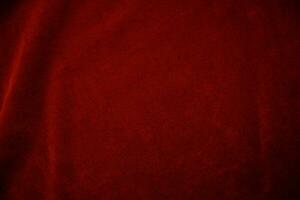 Red velvet fabric texture used as background. red fabric background of soft and smooth textile material. There is space for text.. photo