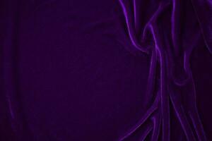 Purple velvet fabric texture used as background. Violet color panne fabric background of soft and smooth textile material. crushed velvet .luxury magenta tone for silk. photo