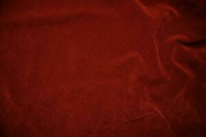 Red velvet fabric texture used as background. red fabric background of soft and smooth textile material. There is space for text.. photo