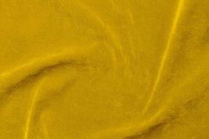 Yellow velvet fabric texture used as background. violet fabric background of soft and smooth textile material. There is space for text. photo
