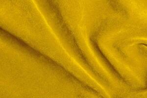 Yellow velvet fabric texture used as background. violet fabric background of soft and smooth textile material. There is space for text. photo