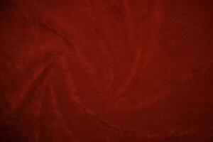 Red velvet fabric texture used as background. red fabric background of soft and smooth textile material. There is space for text.. photo