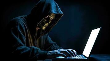 Closeup Portrait of Man Wearing Golden Fawkes Mask with Blue Hoodie and Using Laptop In Dark Background. Concept of Hacker or Cyber Attack. Generative AI. photo