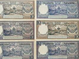 Portrait of old Indonesian banknotes Rp.10,00 rupiah issued in 1963. Old rupiah currency conceptual, top view photo