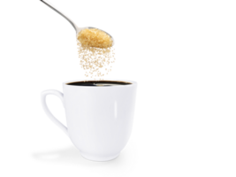 A spoonful of granulated sugar is poured into a white coffee mug. isolated  PNG transparent