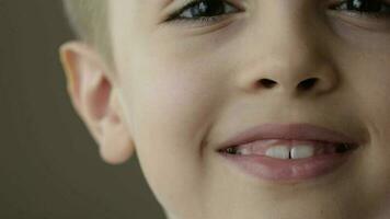 Face of a seven years old boy. Closeup video