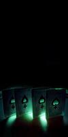 Green Playing Cards with Spade Symbol, Light Effect on Dark Background and Copy Space. . photo
