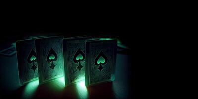 Green Playing Cards with Spade Symbol, Light Effect on Dark Background and Copy Space. . photo
