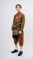 Asian handsome man wearing typical Thai dress with white background, identity culture of Thailand photo