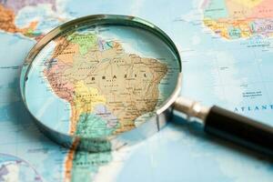 Bangkok, Thailand January 20, 2022 Brazil, Magnifying glass on world map, travel, geography, tourism and exploration concept. photo