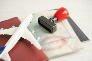 Approved Stamp visa and passport document to immigration at airport in country. photo