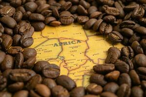 Bangkok, Thailand March 14, 2023 Coffee bean on Africa map, import export trade online commerce concept. photo