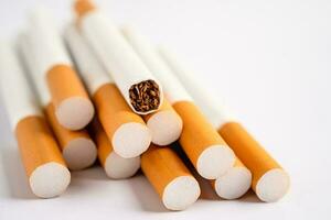 Cigarette, tobacco in roll paper with filter tube, No smoking concept. photo